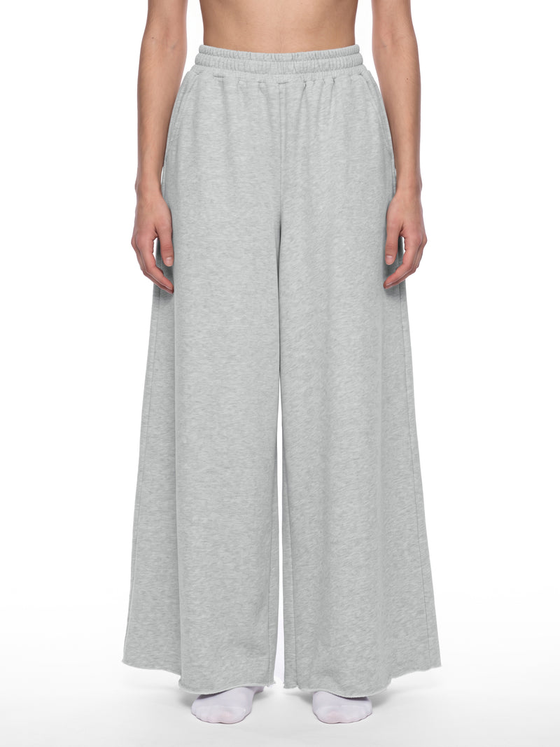 STILL. Women's Raw Edge Wide Leg Sweatpants, worn by a model