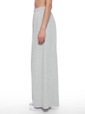 STILL. Women's Raw Edge Wide Leg Sweatpants, worn by a model