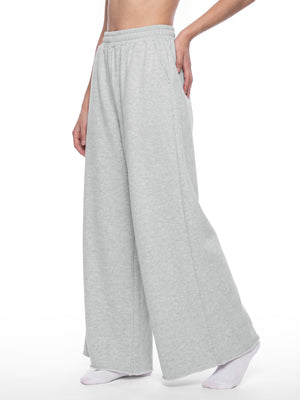 STILL. Women's Raw Edge Wide Leg Sweatpants, worn by a model