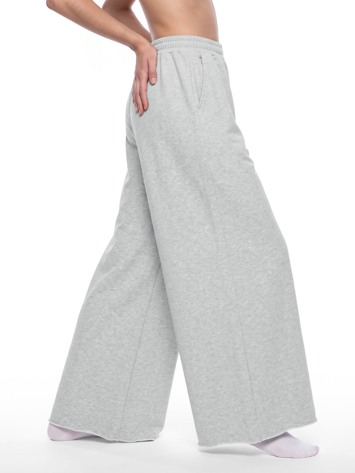 STILL. Women's Raw Edge Wide Leg Sweatpants, worn by a model