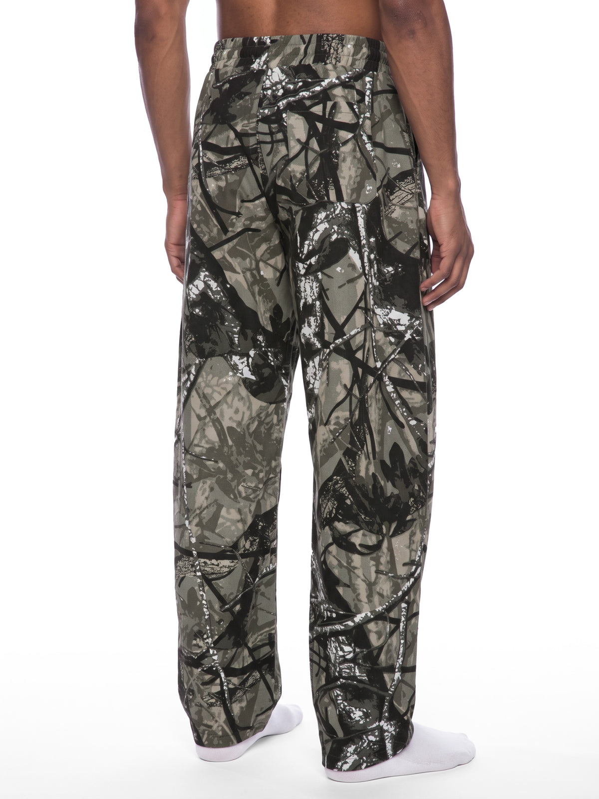 STILL. Unisex Tree Camo Barrel Leg Pants, worn by a model