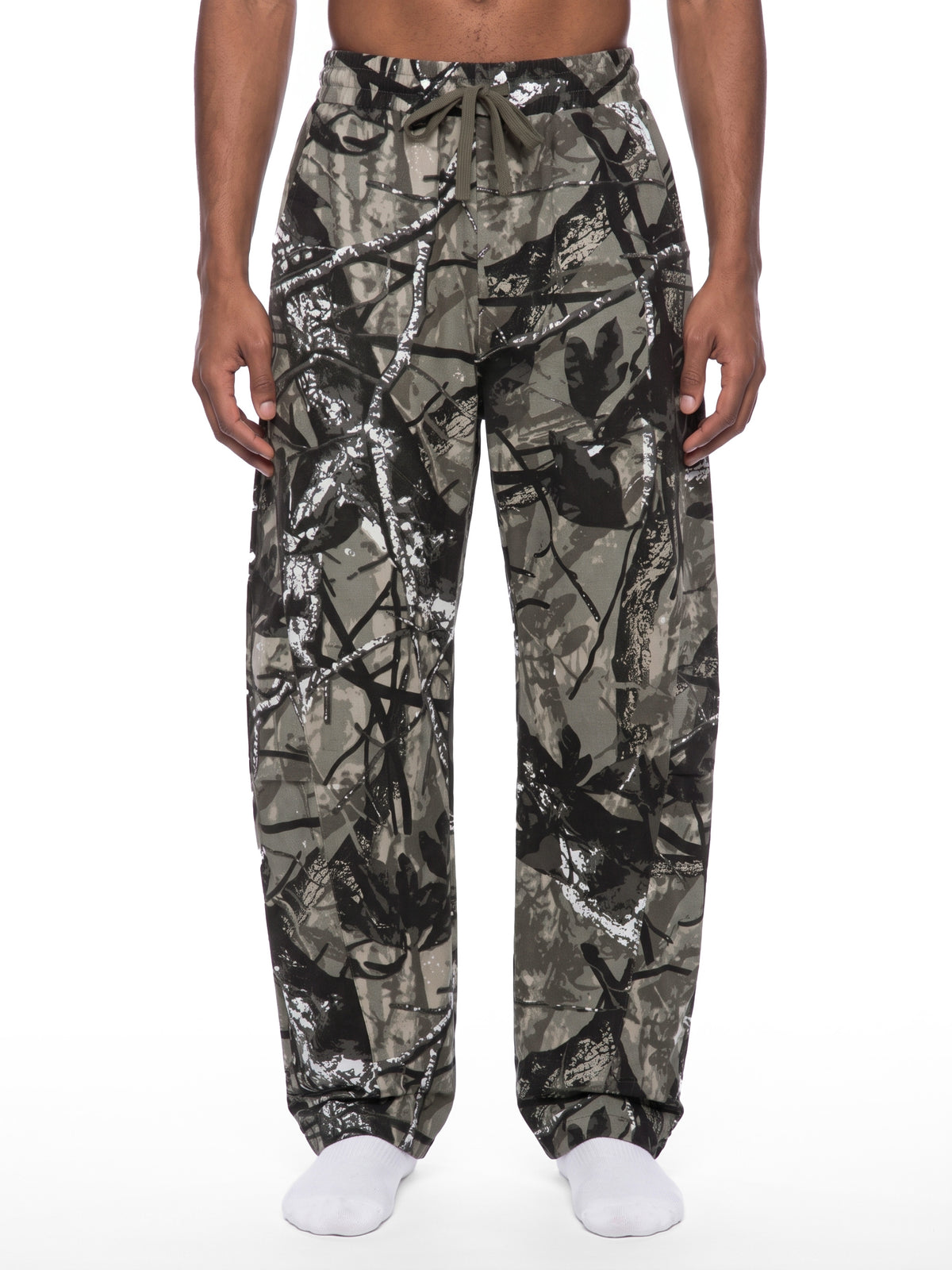 STILL. Unisex Tree Camo Barrel Leg Pants, worn by a model