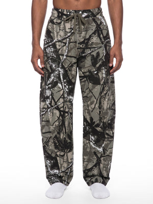 STILL. Unisex Tree Camo Barrel Leg Pants, worn by a model