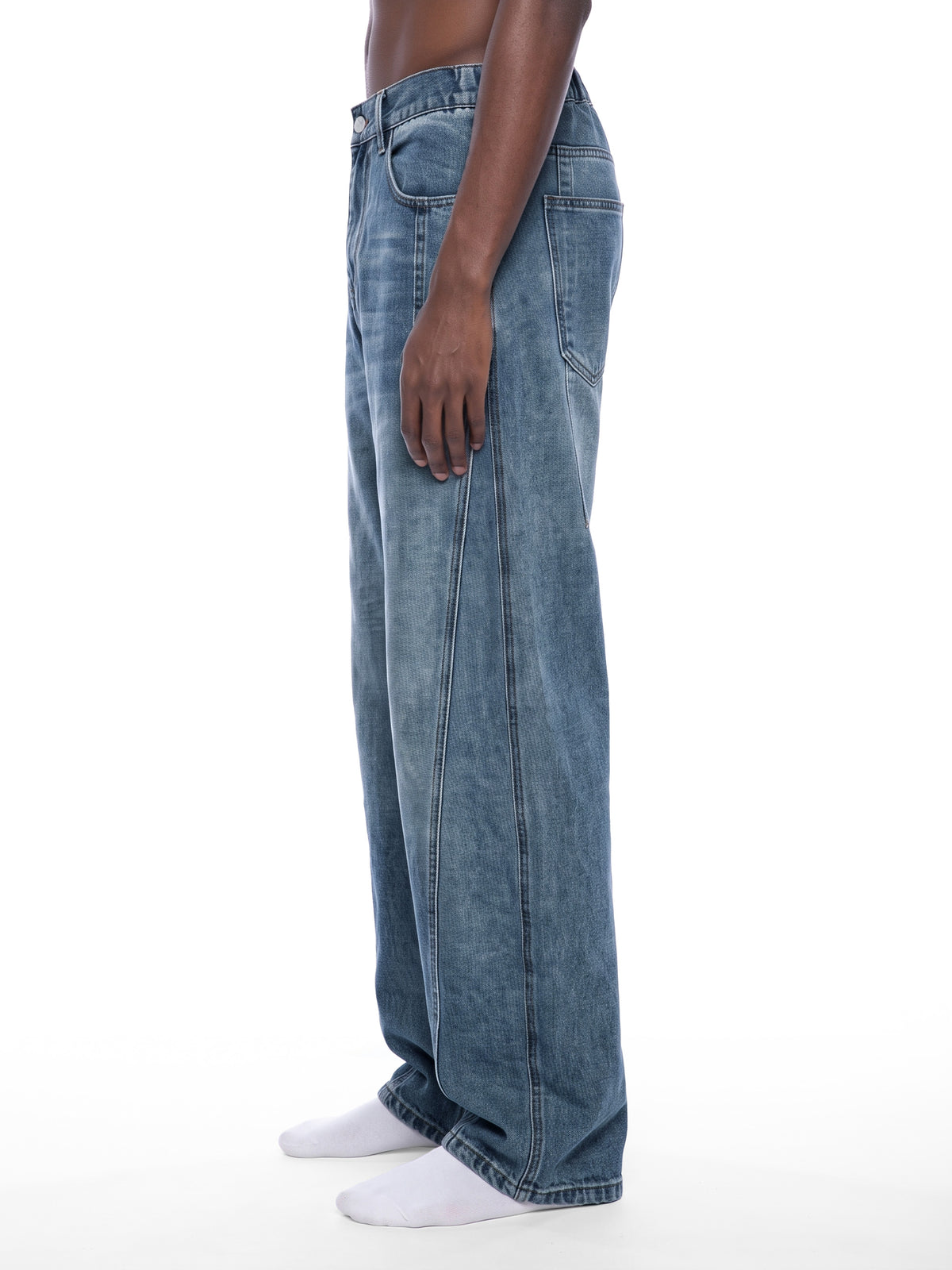 STILL. Unisex Vintage Wash Barrel Leg Jeans, worn by a model