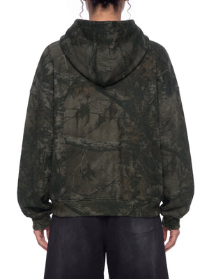 STILL. Unisex Waffle Tree Camo Boxy Hoodie, worn by a model