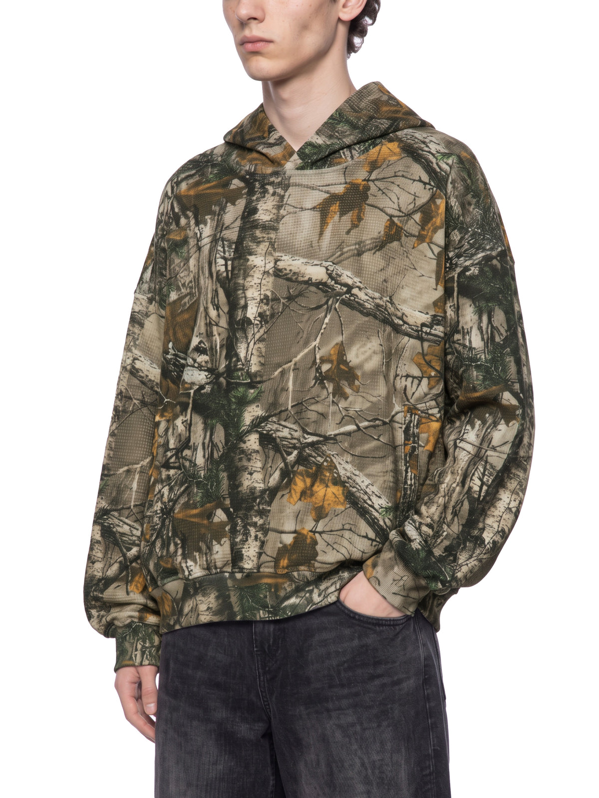 STILL. Unisex Waffle Tree Camo Boxy Hoodie, worn by a model