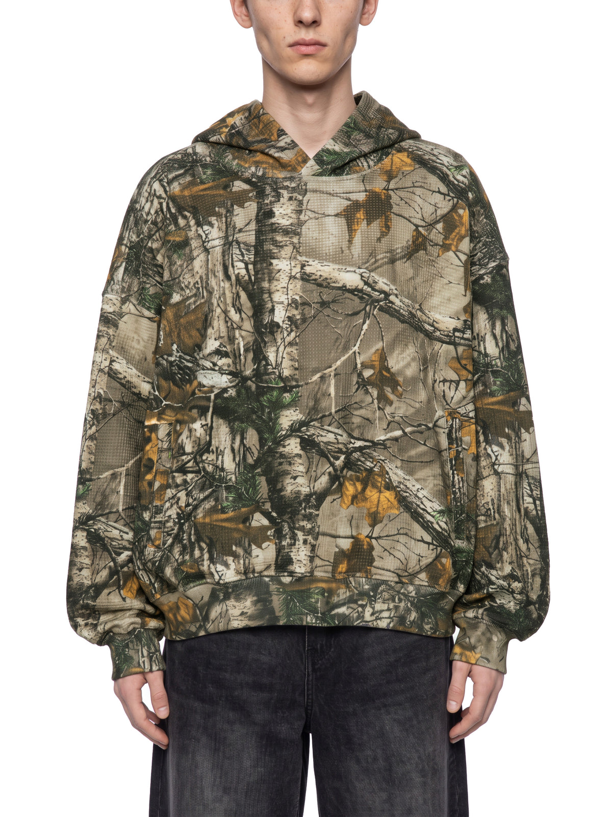 STILL. Unisex Waffle Tree Camo Boxy Hoodie, worn by a model